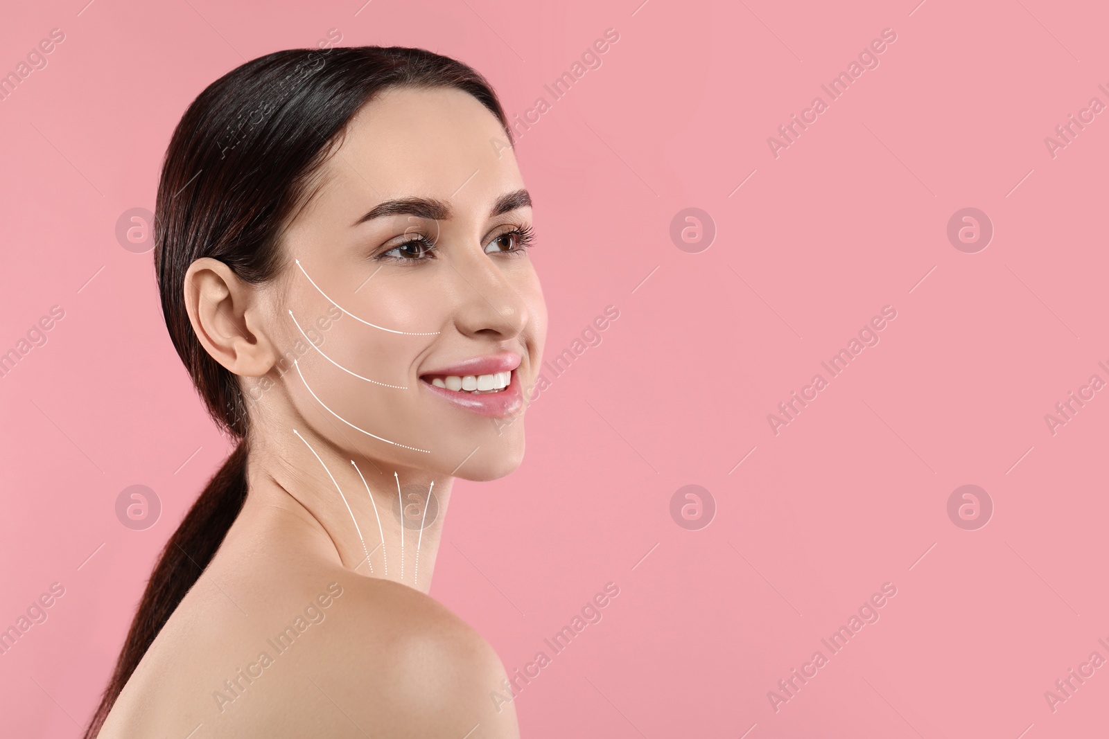 Image of Attractive woman with perfect skin after cosmetic treatment on pink background, space for text. Lifting arrows on her face