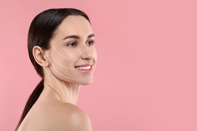 Image of Attractive woman with perfect skin after cosmetic treatment on pink background, space for text. Lifting arrows on her face