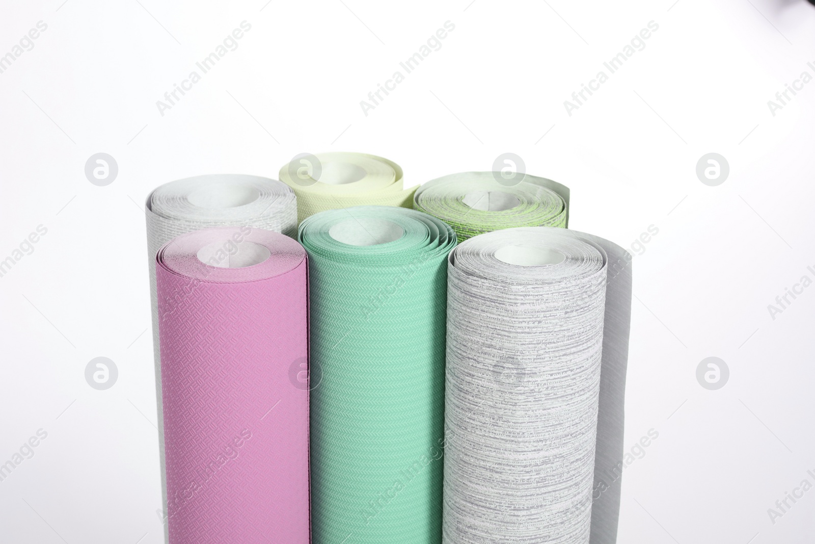 Image of Different colorful wallpaper rolls isolated on white