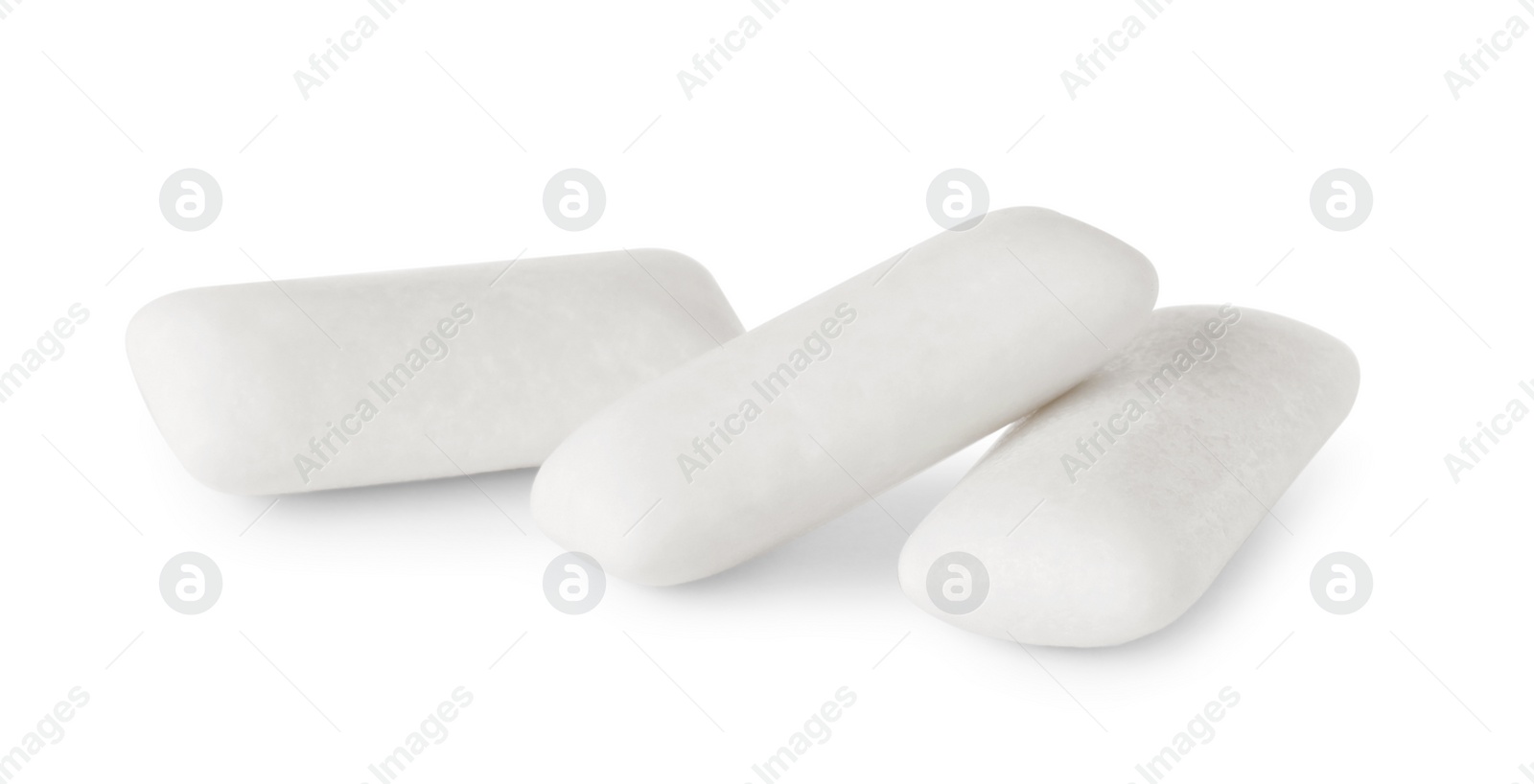 Photo of Many tasty chewing gums on white background