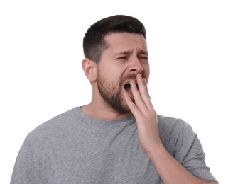 Photo of Sleepy man yawning on white background. Insomnia problem