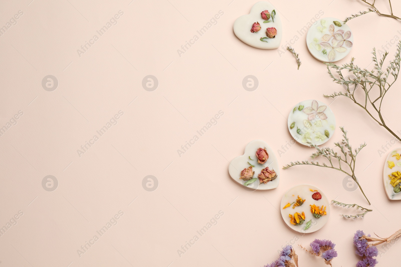 Photo of Flat lay composition with scented sachets on beige background, space for text