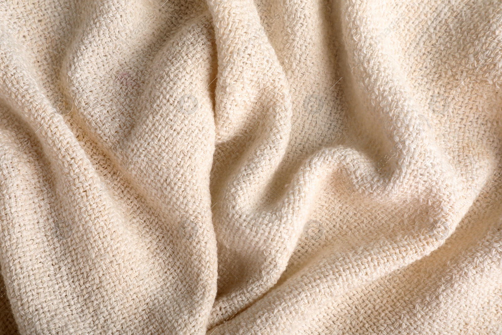 Photo of Beige hemp cloth as background, top view. Natural fabric