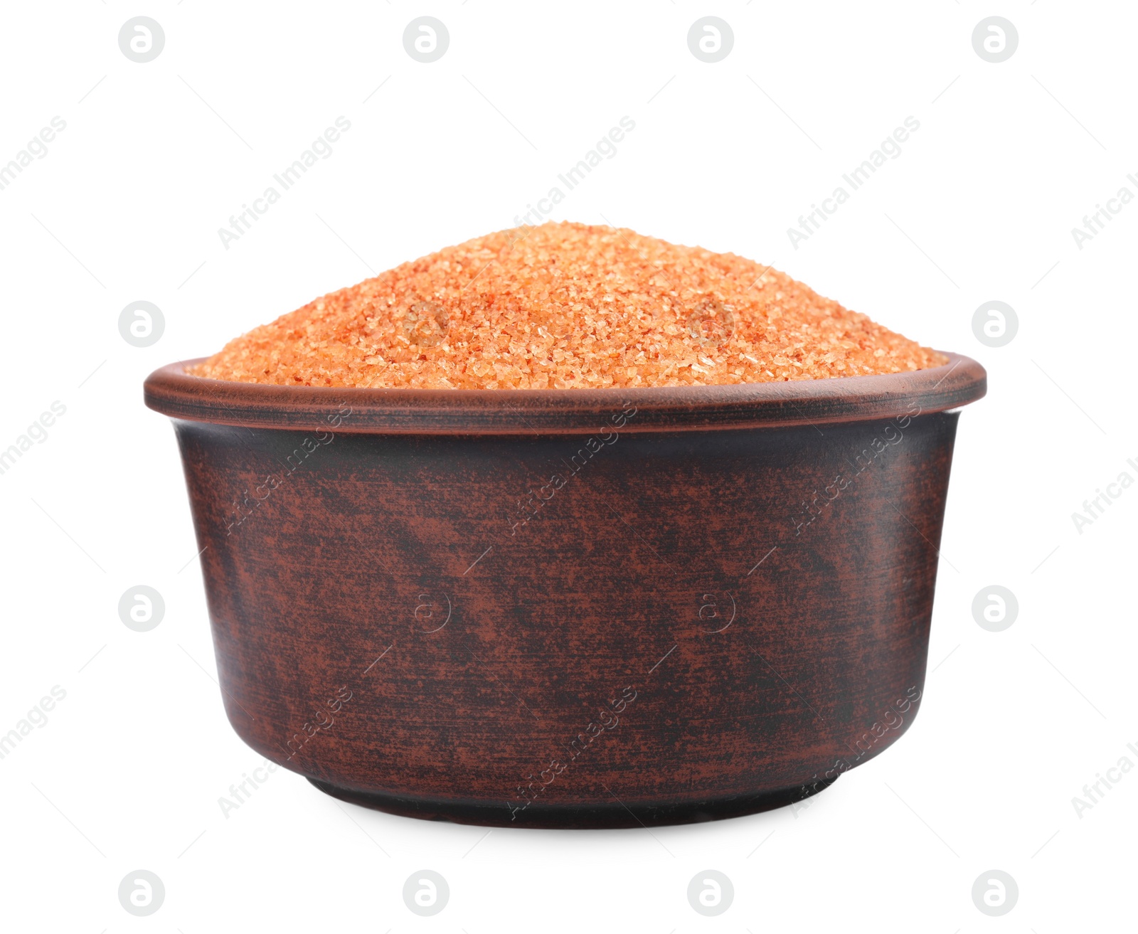 Photo of Orange salt in bowl isolated on white