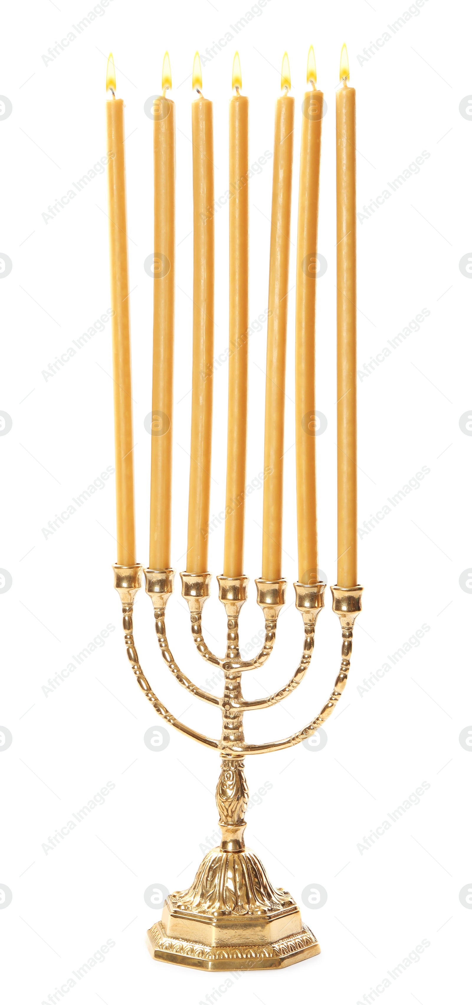 Photo of Golden menorah with burning candles on white background