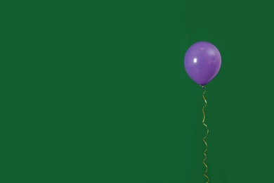 Bright balloon on color background, space for text. Celebration time