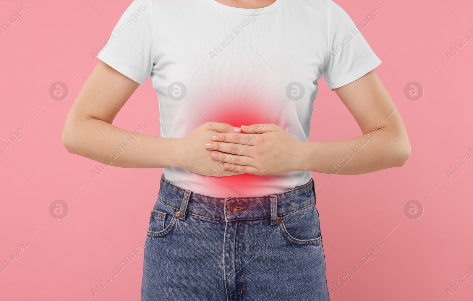 Image of Woman suffering from stomach pain on pink background, closeup