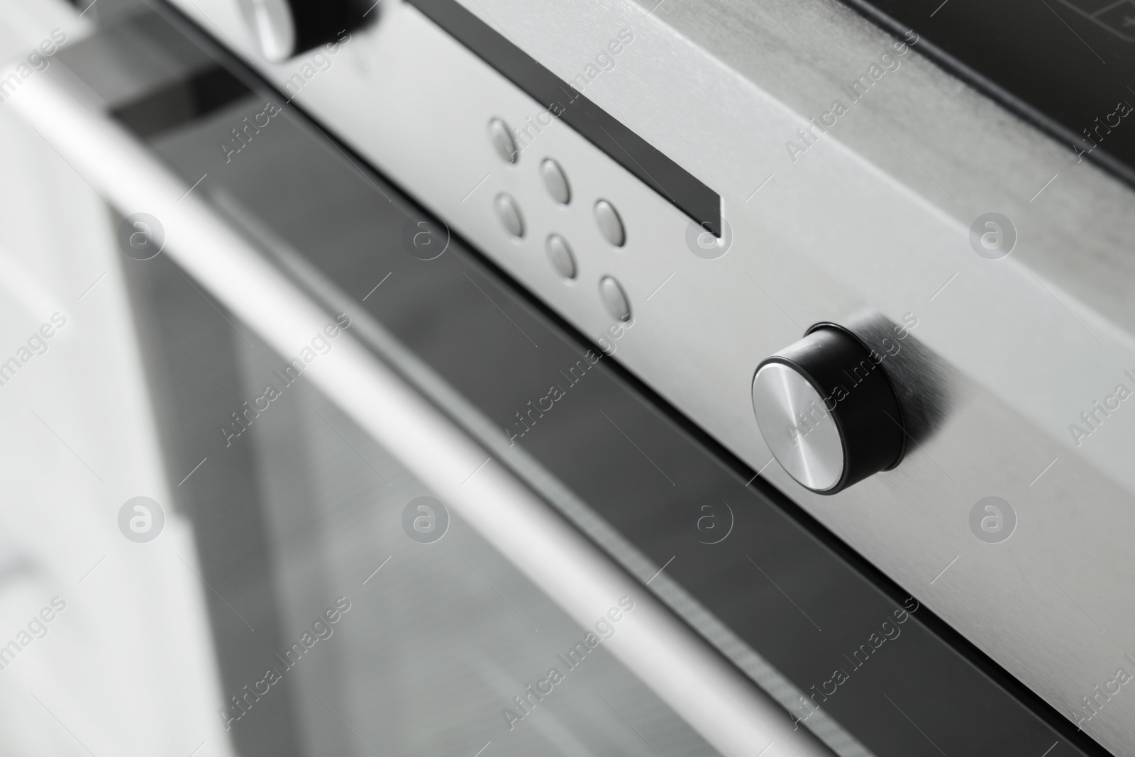 Photo of Oven setting panel with display and buttons, closeup