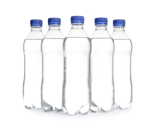 Photo of Plastic bottles with pure water on white background