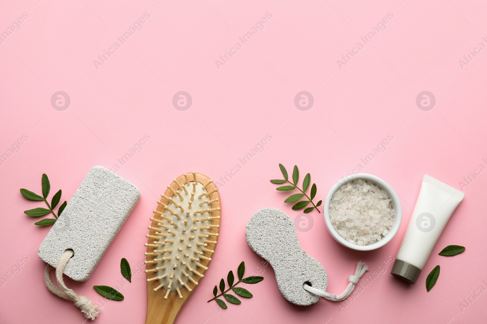 Photo of Flat lay composition with pumice stones on pink background. Space for text