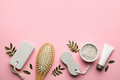 Flat lay composition with pumice stones on pink background. Space for text