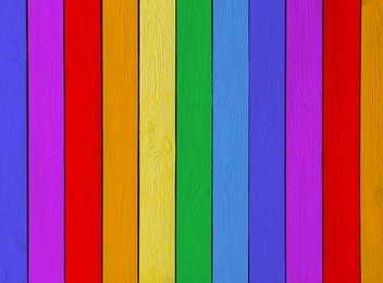 Wooden planks in rainbow colors as background