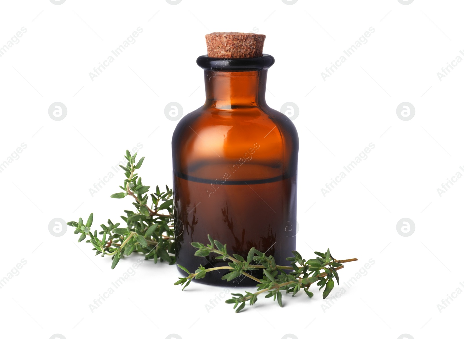 Photo of Bottle of thyme essential oil and fresh plant isolated on white