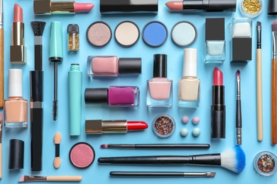 Flat lay composition with decorative cosmetics on color background