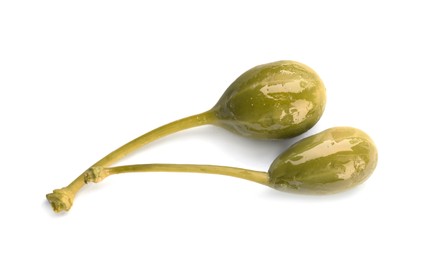 Photo of Two delicious pickled capers on white background, top view
