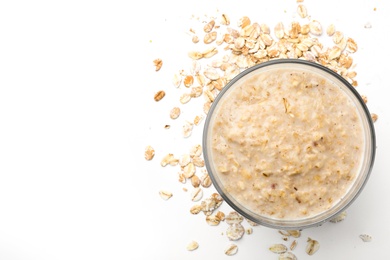 Photo of Handmade oatmeal face mask and ingredient on white background, top view