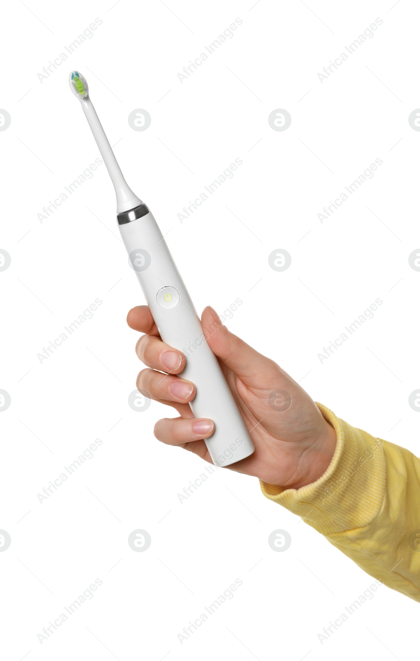 Photo of Woman holding electric toothbrush on white background, closeup