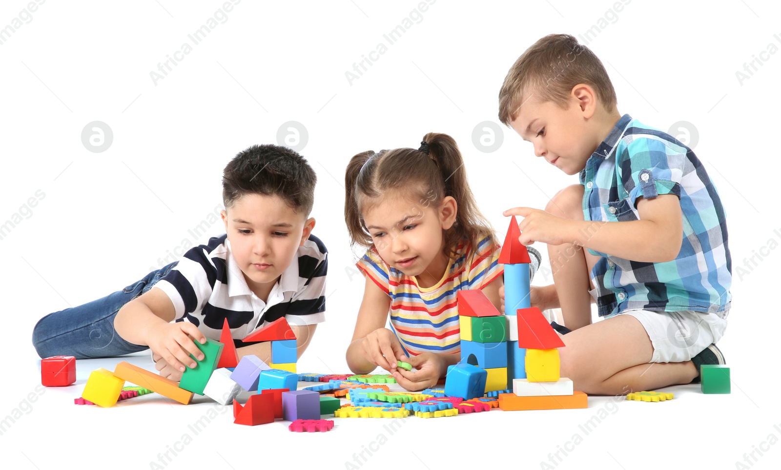 Photo of Little children playing together on white background. Indoor entertainment