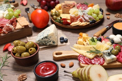 Photo of Many different appetizers served on wooden table