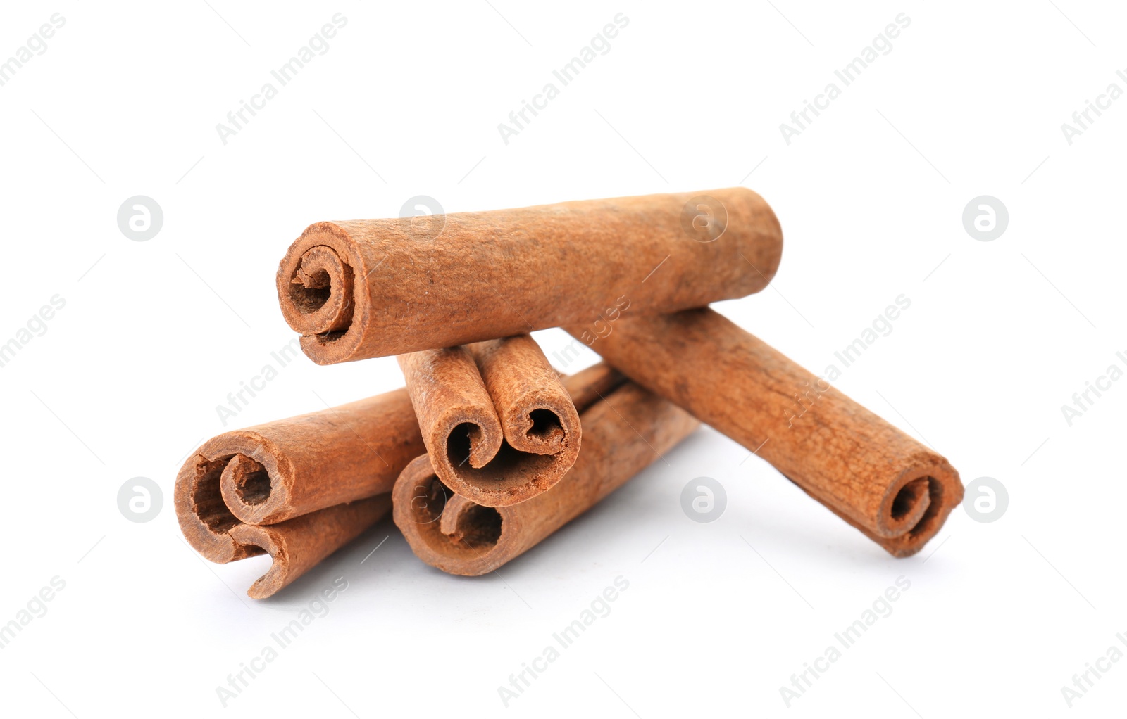 Photo of Aromatic cinnamon sticks on white background