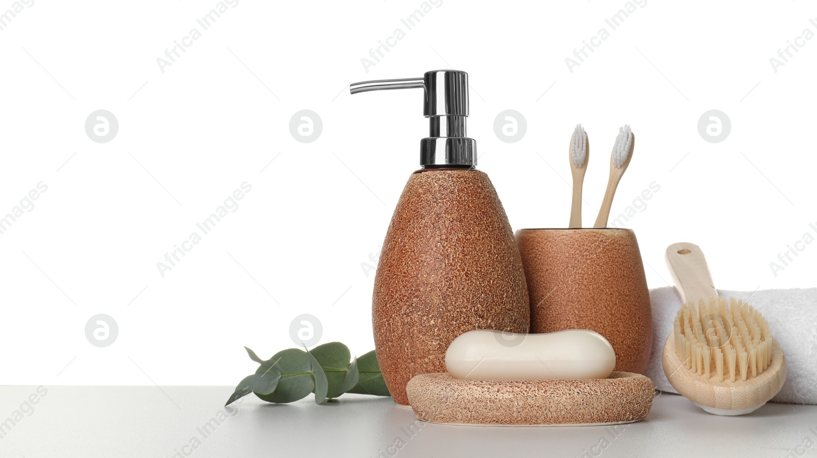 Photo of Bath accessories. Different personal care products and eucalyptus branch on table against white background. Space for text