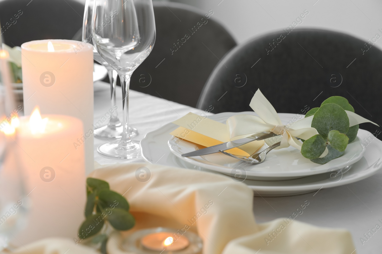 Photo of Festive table setting with beautiful floral decor in restaurant