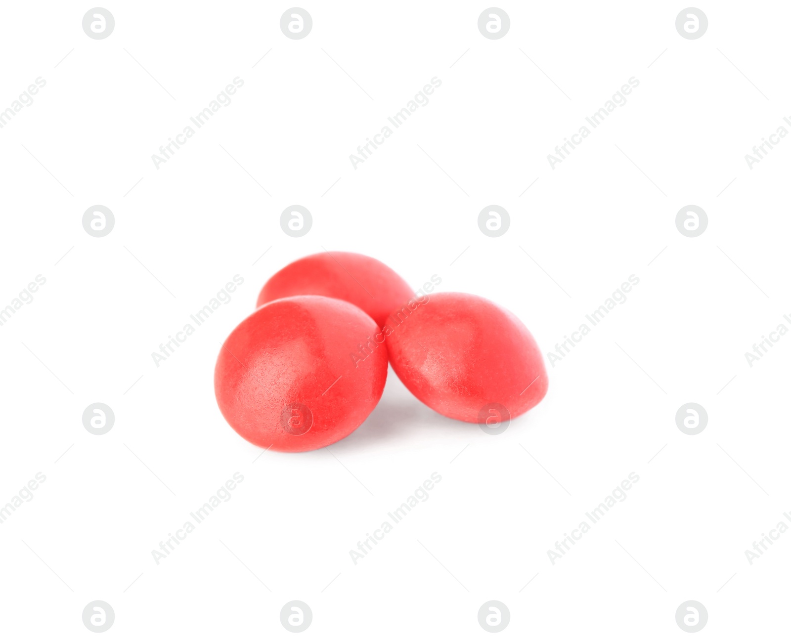 Photo of Tasty red chewing gums isolated on white