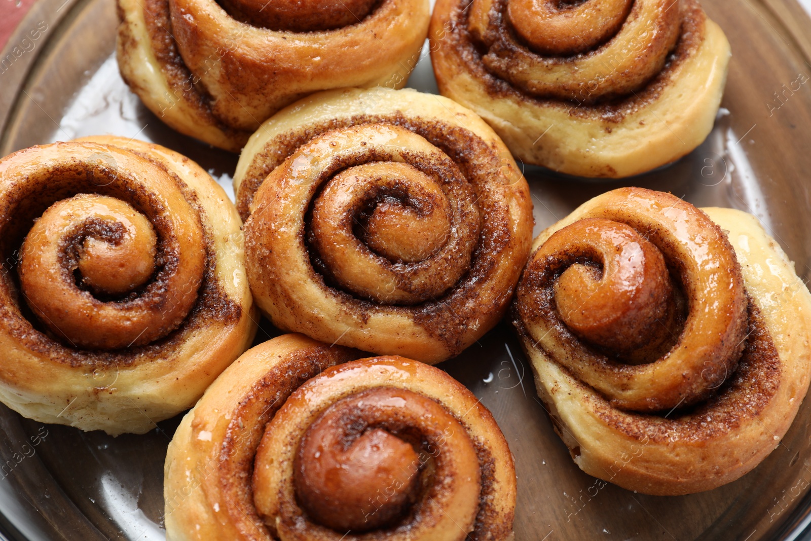 Photo of Tasty cinnamon rolls on table, top view