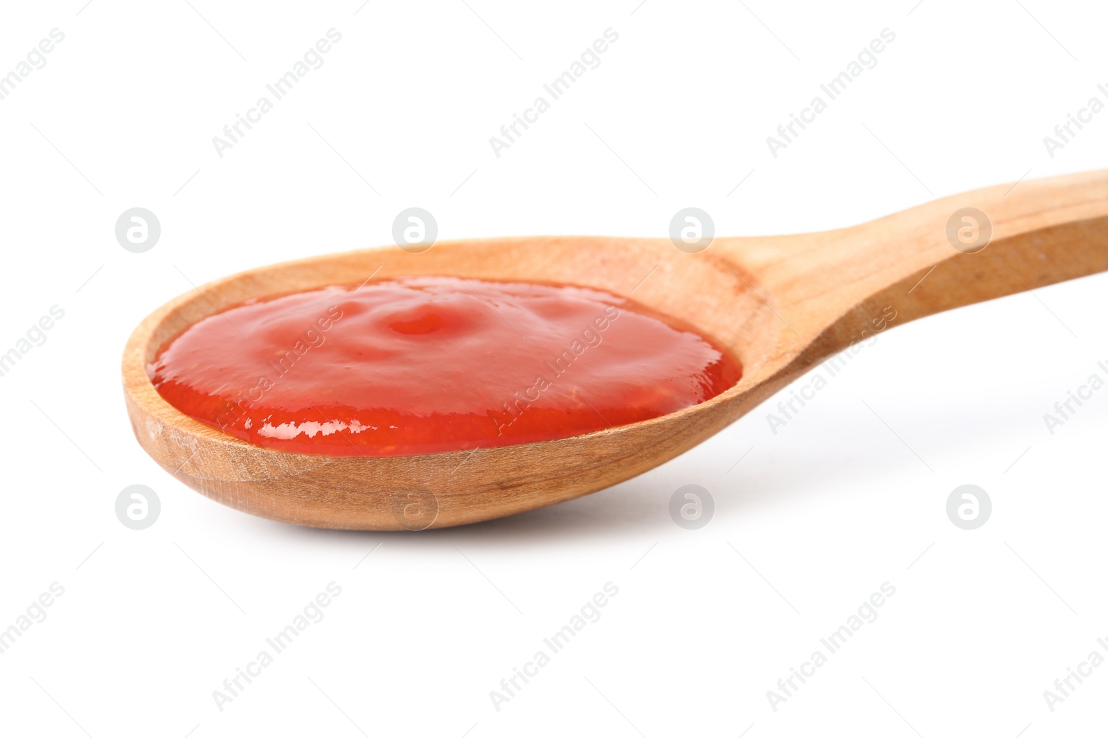 Photo of Spoon of tasty tomato sauce isolated on white