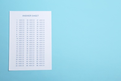 Photo of Answer sheet on color background, top view with space for text