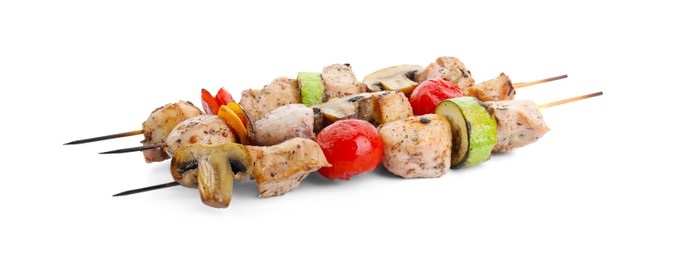 Photo of Delicious shish kebabs and grilled vegetables isolated on white