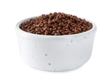 Buckwheat tea granules in bowl on white background
