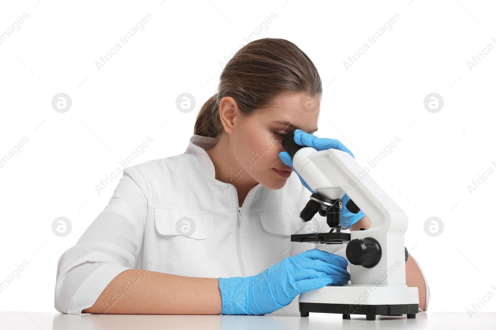 Photo of Scientist using modern microscope at table isolated on white. Medical research