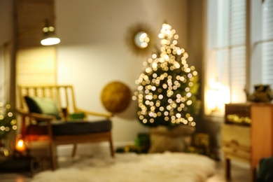 Stylish room interior with elegant Christmas decor, blurred view