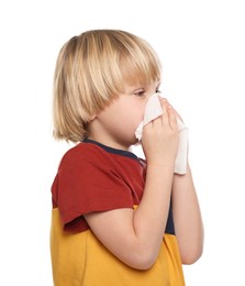 Photo of Boy blowing nose in tissue on white background, space for text. Cold symptoms