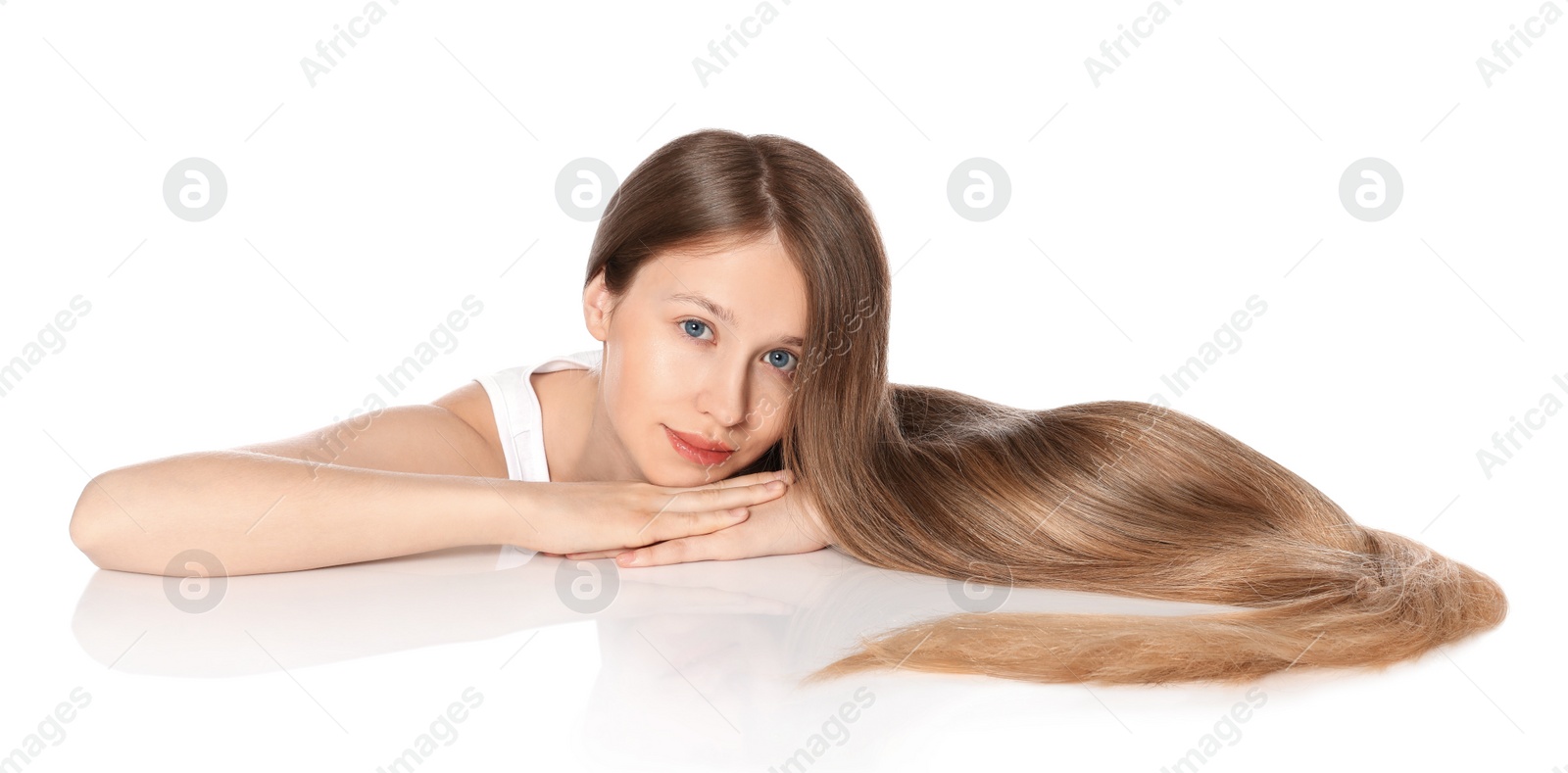 Photo of Teenage girl with strong healthy hair on white background