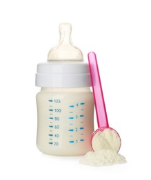 Photo of Feeding bottle with infant formula and scoop of powder on white background. Baby milk