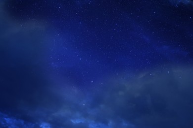 Image of Beautiful view of night sky with clouds and stars