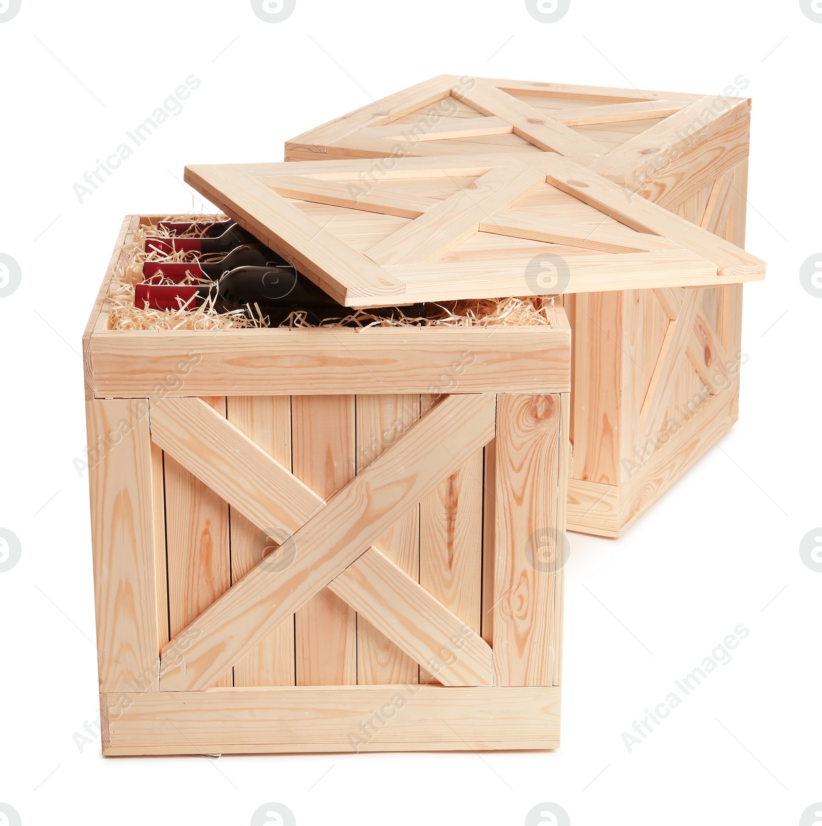 Photo of Wooden crates with bottles of wine isolated on white