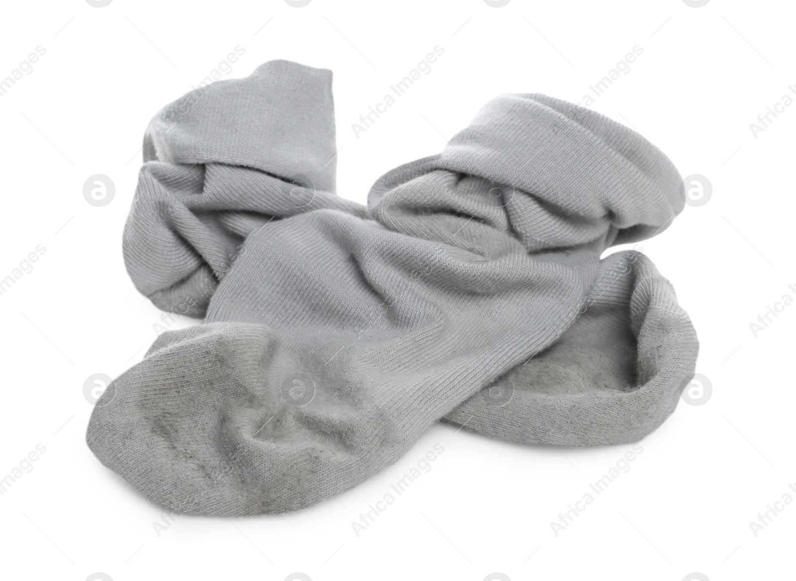 Photo of Pair of dirty socks on white background