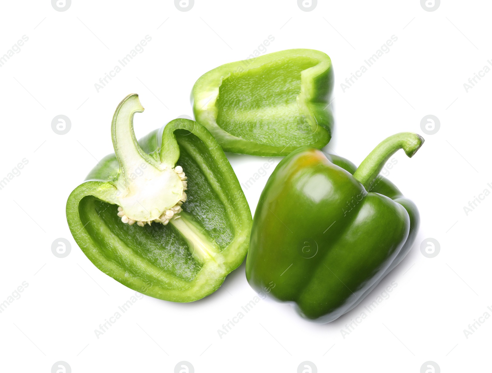 Photo of Whole and cut green bell peppers on white background, top view