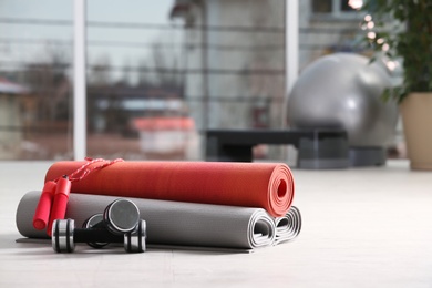 Set of fitness equipment of floor indoors. Space for text