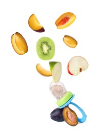 Image of Empty nibbler and pieces of different fruits falling on white background. Baby feeder