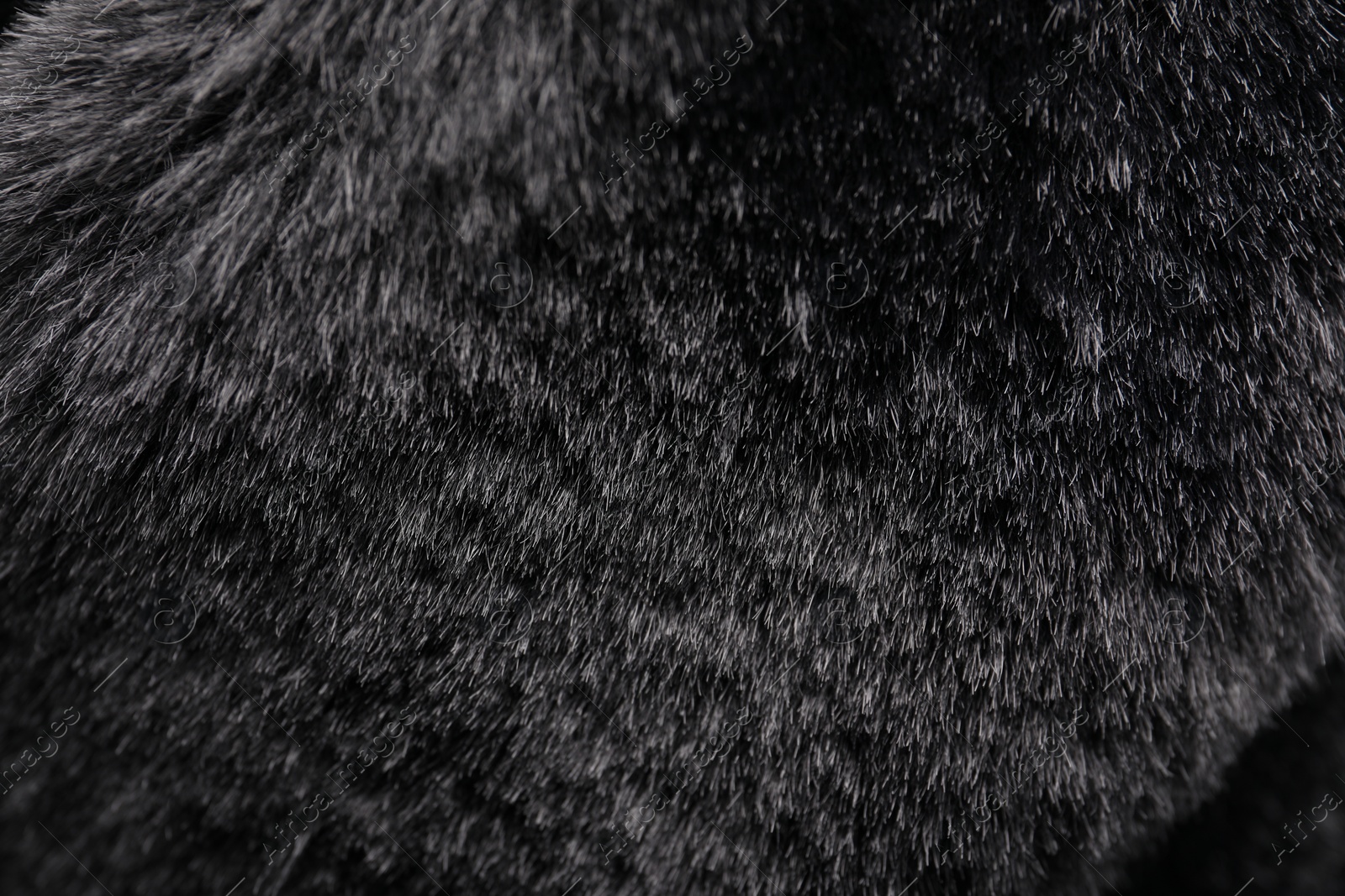 Photo of Texture of dark grey faux fur as background, closeup