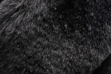 Photo of Texture of dark grey faux fur as background, closeup