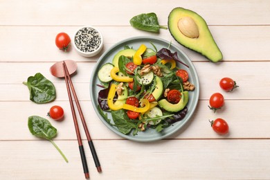 Photo of Balanced diet and vegetarian foods. Plate with different delicious products on wooden table, flat lay