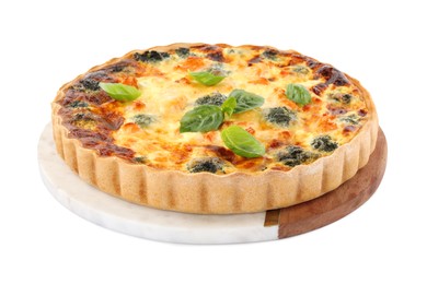 Delicious homemade quiche with salmon, broccoli and basil leaves isolated on white