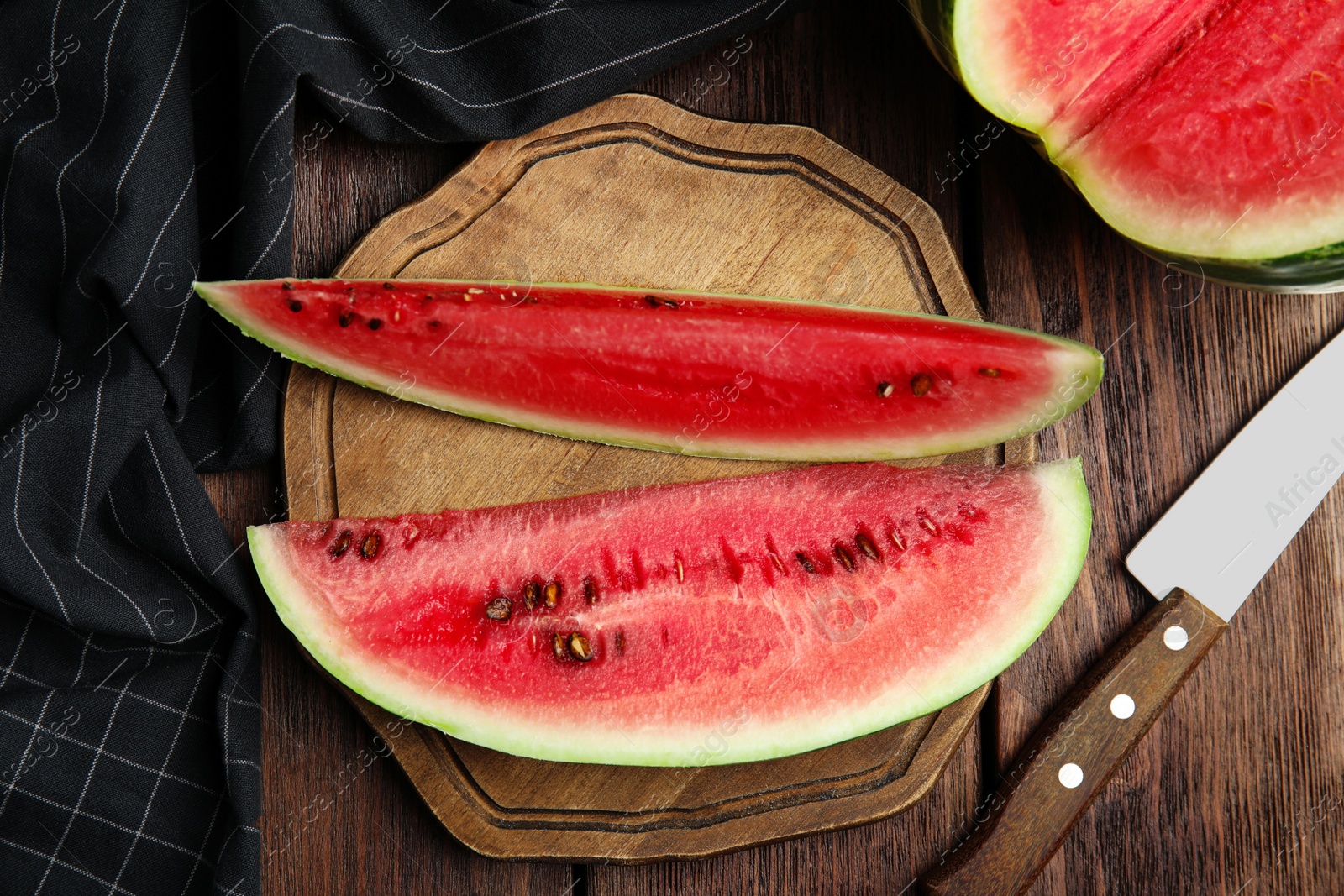 Photo of Yummy watermelon on wooden table, flat lay