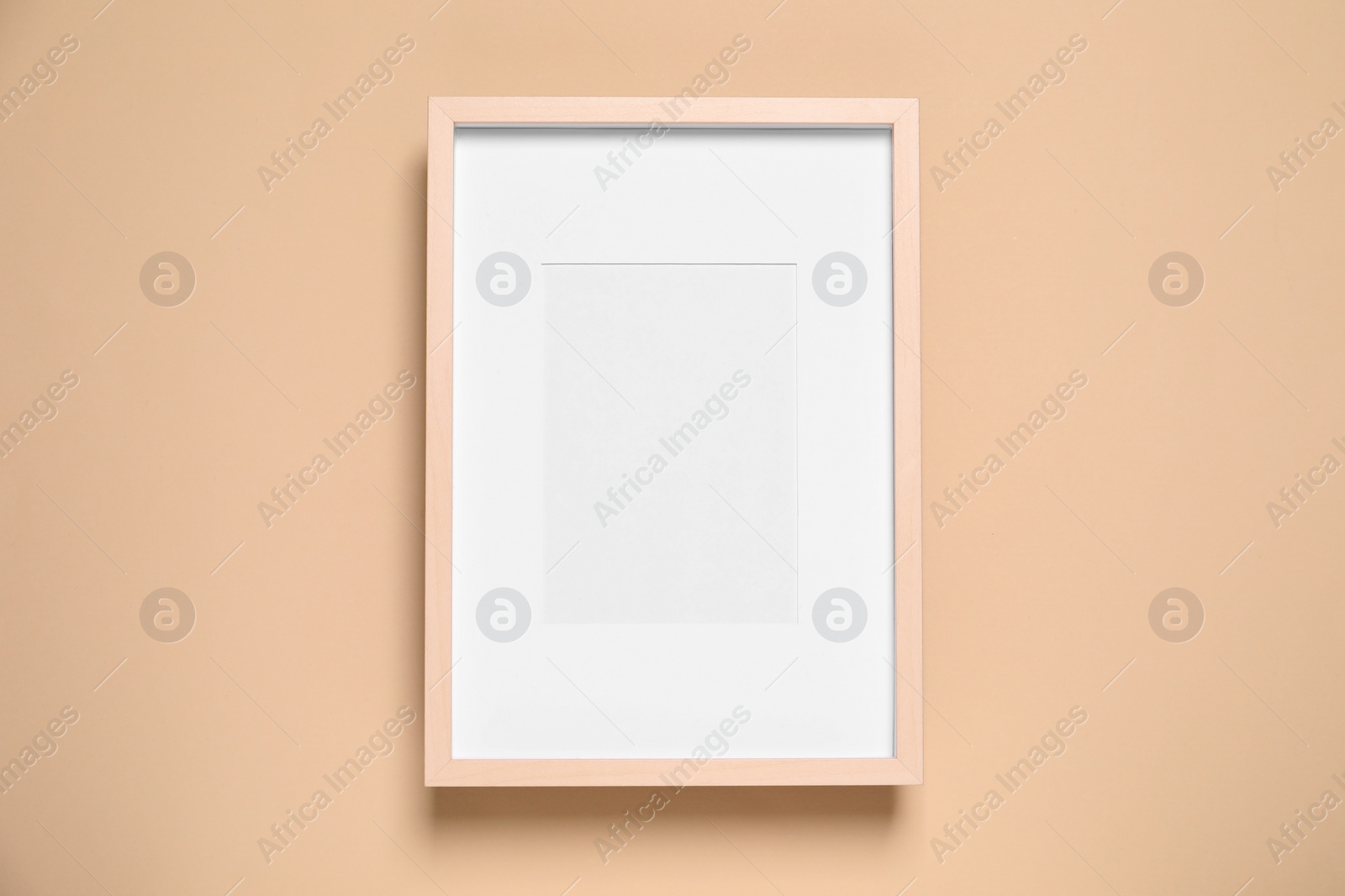 Photo of Empty photo frame on beige background, top view. Space for design