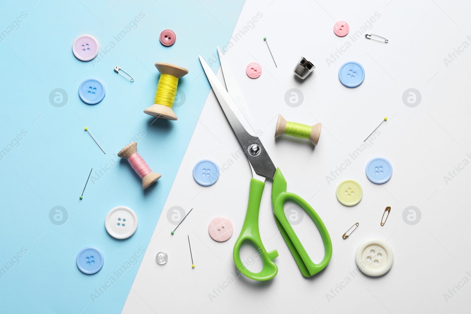 Photo of Flat lay composition with scissors on color background